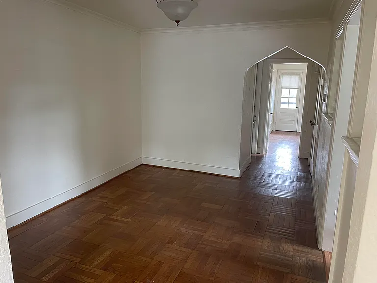 Dining room facing back hall and bedroom