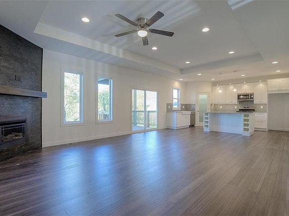 GREAT ROOM WITH WARM ENGINEERED BAMBOO FLOORING AND CUSTOM LIGHTING (Without Virtual Staging)