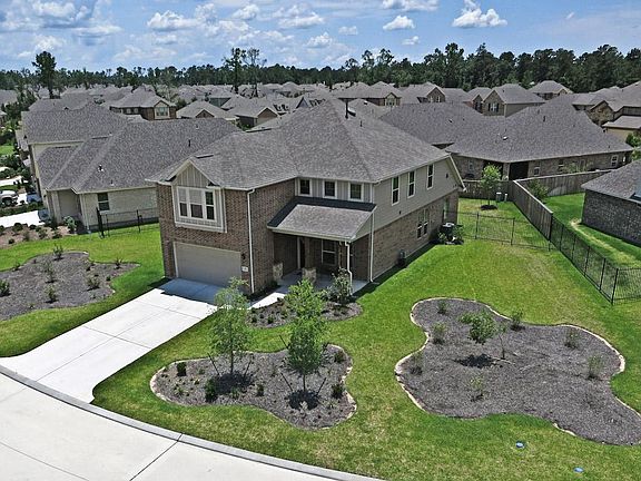Another view of this stately home w/ lots of green space to call your own!