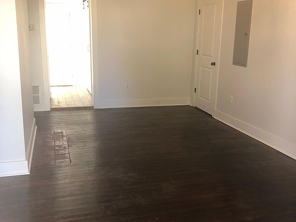 Unit A Family Room- Original restored hardwood floors