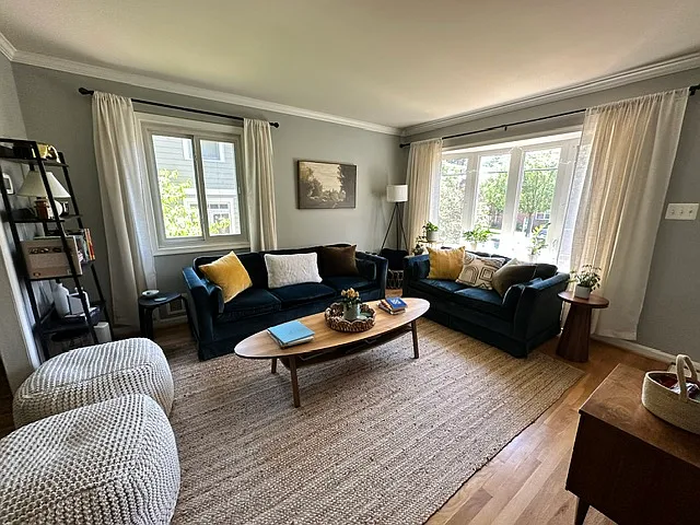 Light filled living room with hardwood floors.