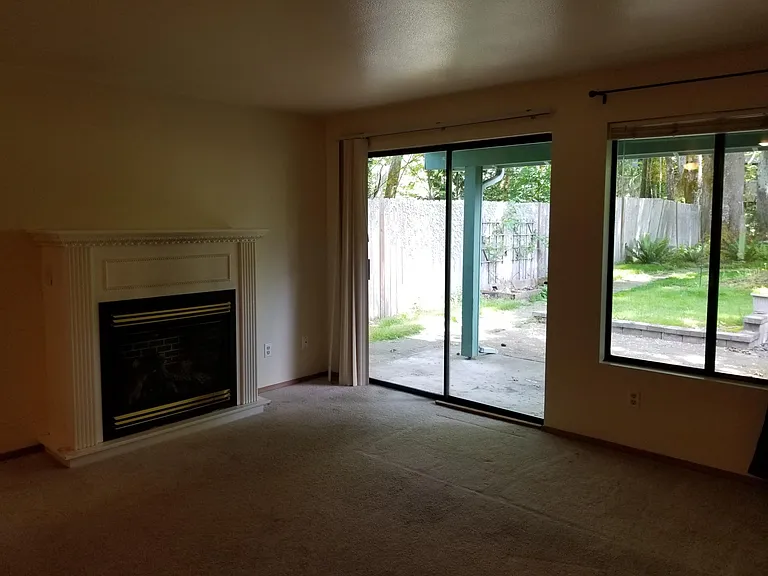Living room and door out to covered patio
