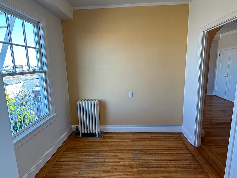 Breakfast nook near kitchen. Last tenant used this as an office counterspace. That's a steam radiator, which means your PG&E heating costs are super low cost.