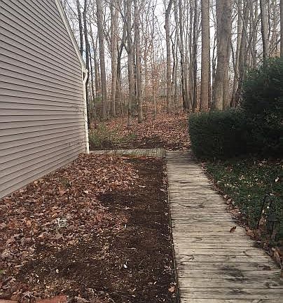 Wood walkway to back yard 
