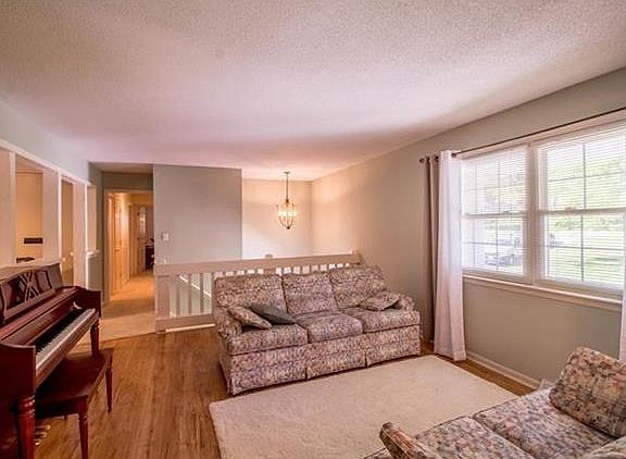 Large living room has so much natural light.   And, it is open to the family room and dining room.