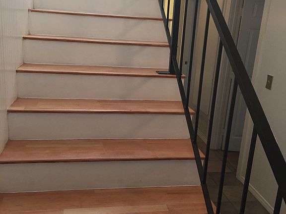 Stairs leading upstairs to kitchen