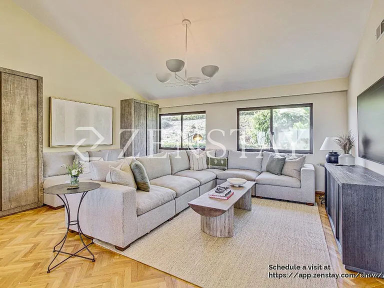 Sun-filled living area designed for comfort, gathering, and easy entertaining