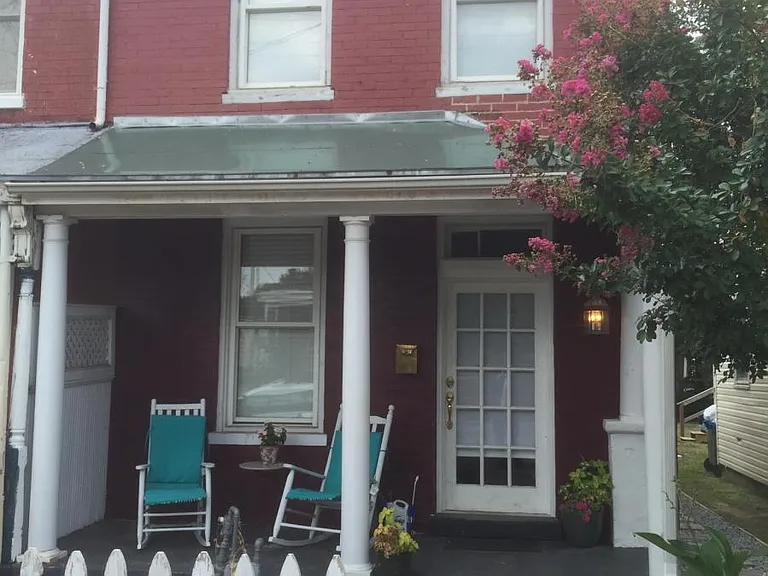 brick exterior, large covered front porch