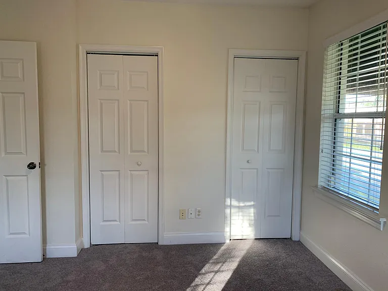Bedroom 2, closet doors (closet spans the whole length)