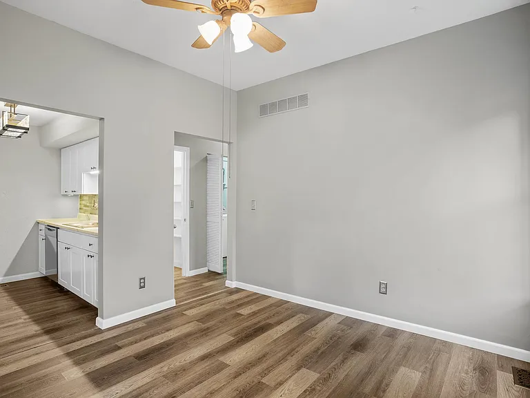 Dining room; all new flooring and baseboards throughout the unit