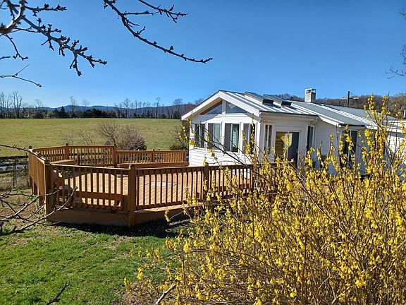 Lake cottage with deck looking west.