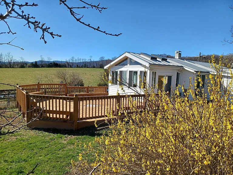 Lake cottage with deck looking west.