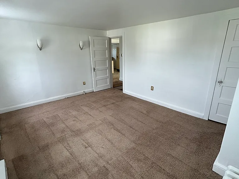 Primary bedroom includes large closet and plenty of natural light.