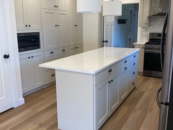 Gorgeous, updated kitchen. Tons of cabinets. Built in microwave. Fridge included.