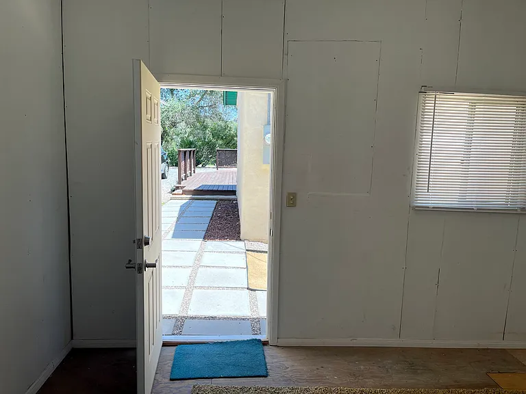 Looking out from inside #1 storage/craft room towards main deck and home.
