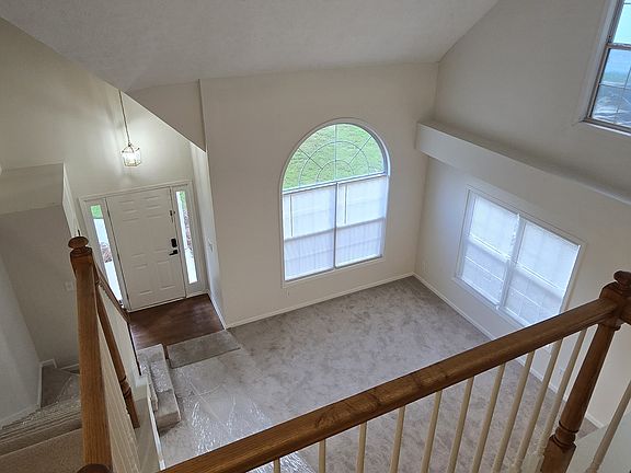looking down from upstairs to living room