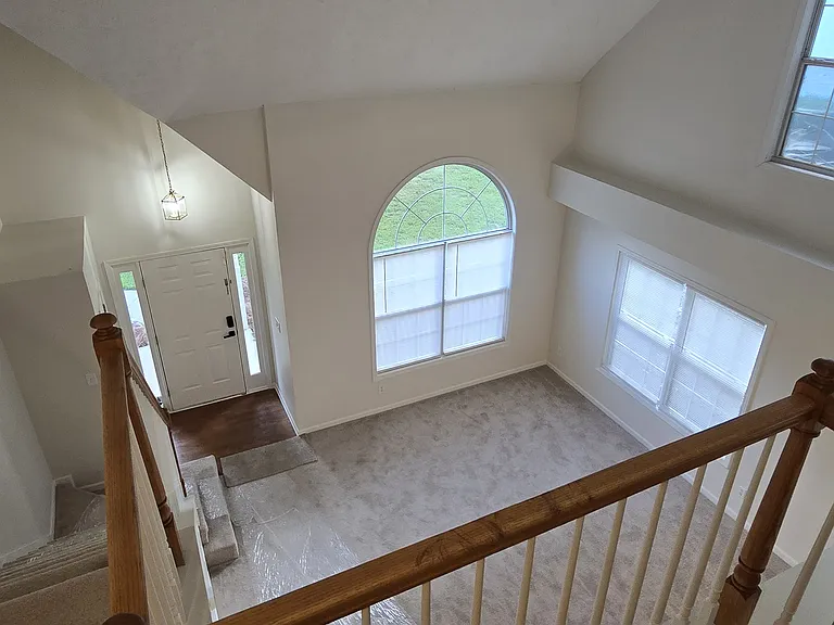 looking down from upstairs to living room