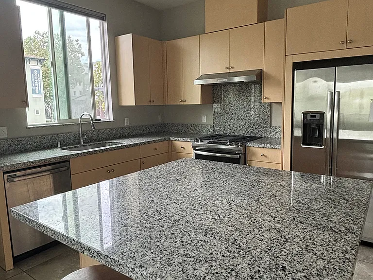 Large kitchen area with modern appliances.