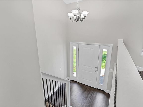 Beautiful entry with new door and custom railings