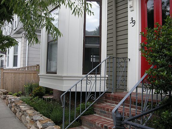 Gloucester Sage historic paint complements the New England fieldstone wall