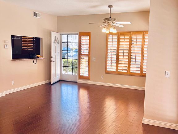 Laminate flooring and wood shutters welcome you in to this clean, spacious home