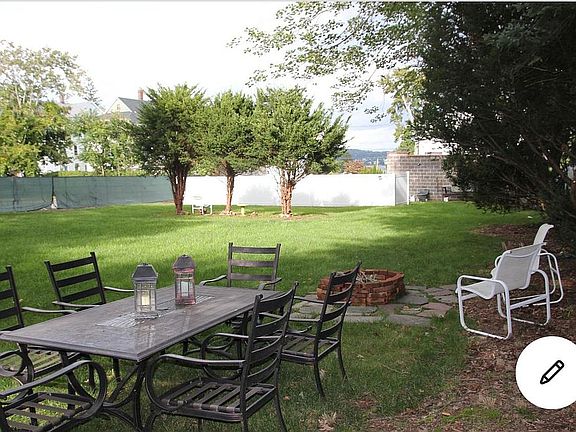 Private fenced back yard with fire pit