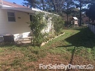 Back of house : Large backyard with awning and insulated shed.