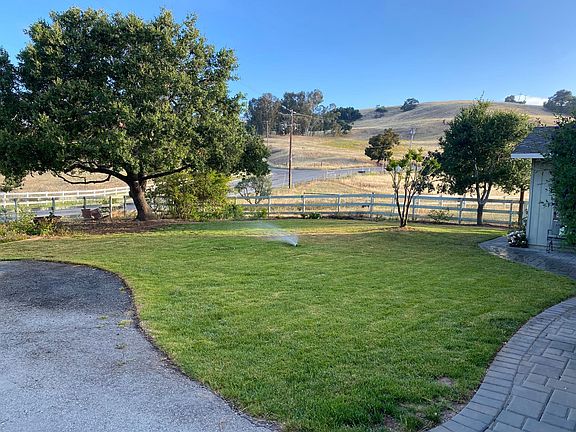 View up the road toward Estates Drive, and beyond that, Mendoza Ranch