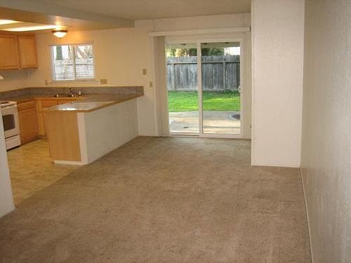 Family room & kitchen view from entry. Slider to HUGE back
