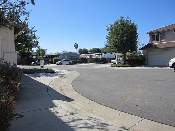 View from garage door showing auxiliary parking very nearby. One house awayto Wanek Road, WanekRd has zero through traffic with housing on only one side. Parking always avaiable.