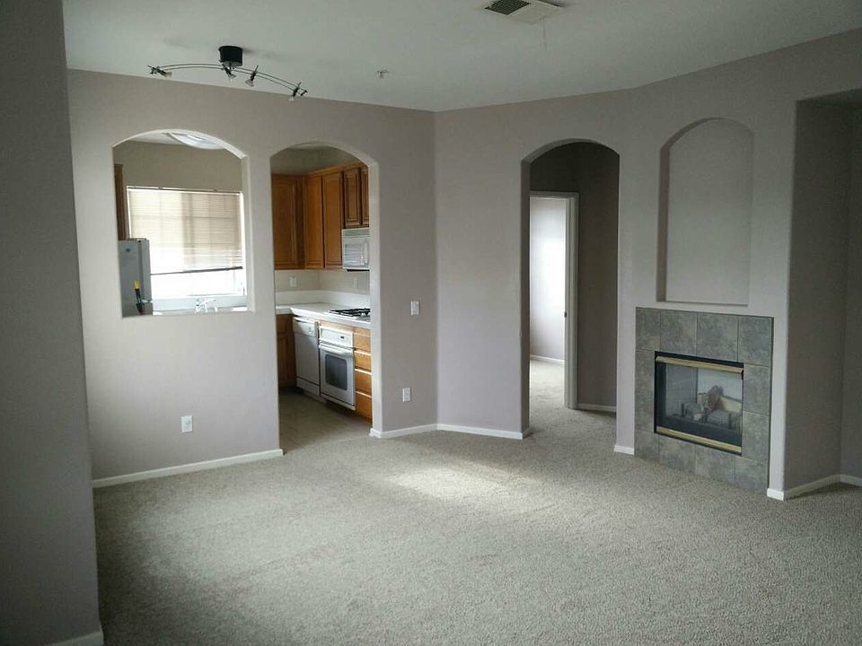 Dining/Living room, kitchen, and entrance to 3rd BR and full
