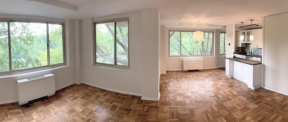 Panorama of living room, dining room and kitchen