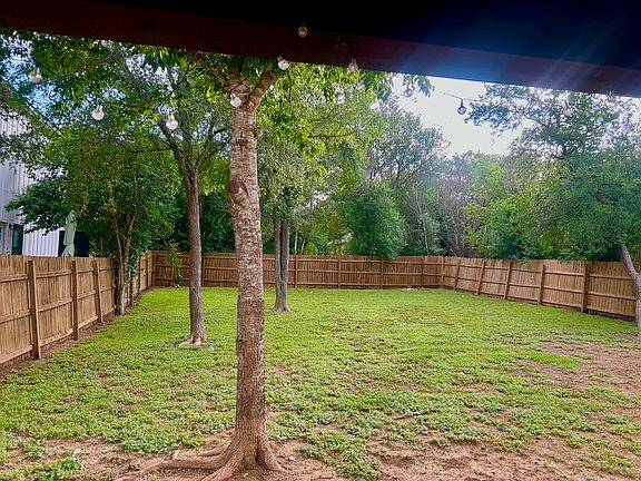 4,900SF fenced and double gated backyard.