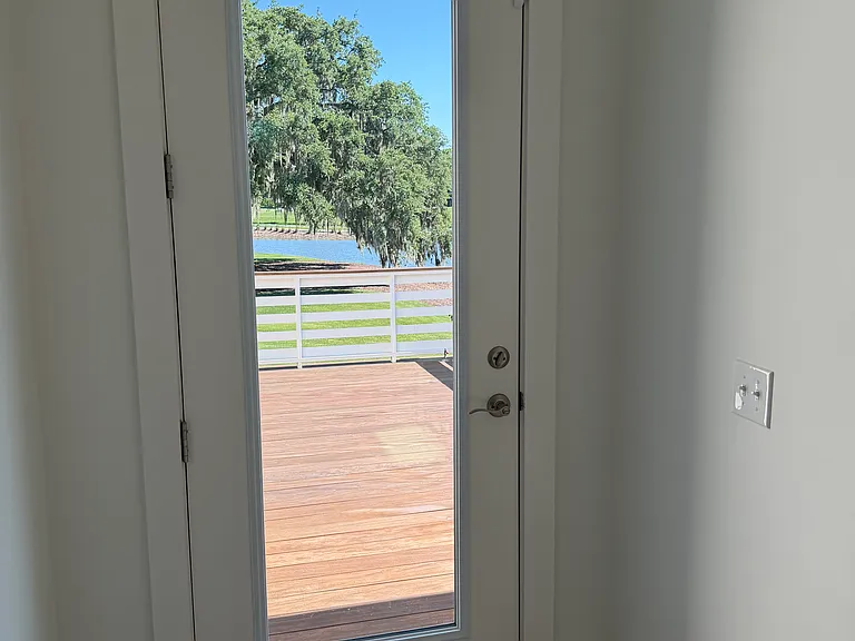 Door from mudroom to open part of back deck with gas grill connection