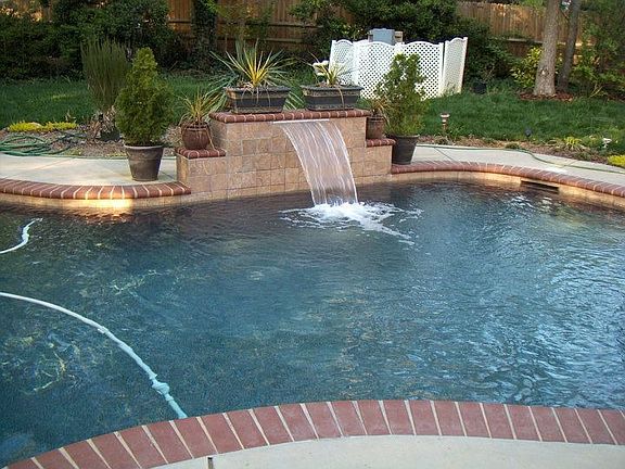 In-ground custom pool with waterfall