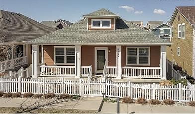 Front of home. Beautiful large front porch. Grass dog and walking area in front.