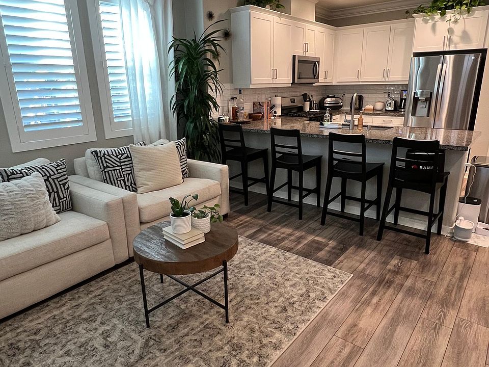Main floor open kitchen with area that can be utilized as dining room with a dining table or seating area.