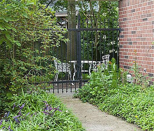 Charming side entry to peaceful back yard garden.