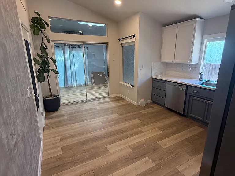 Kitchen leading to bonus room
