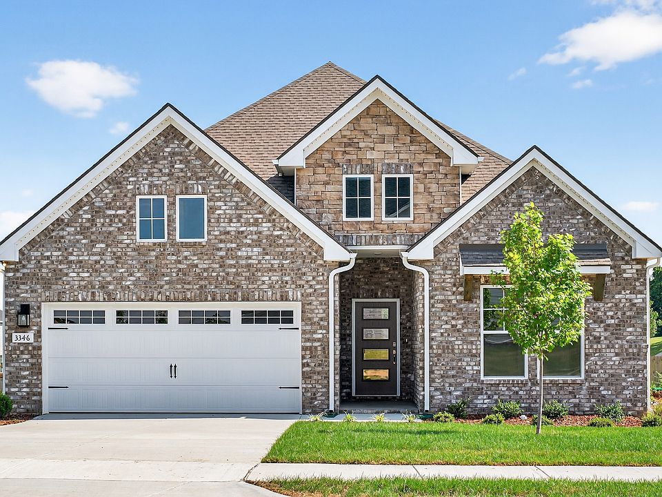 Exquisite brickwork and modern gabled roof design define this Harpeth residence in McClure Farms.