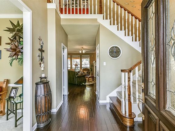 Bright two story entry with Formal Dining Room to the left.