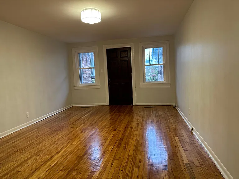 Refinished hardwood floors, new paint and upgraded lighting welcome you home