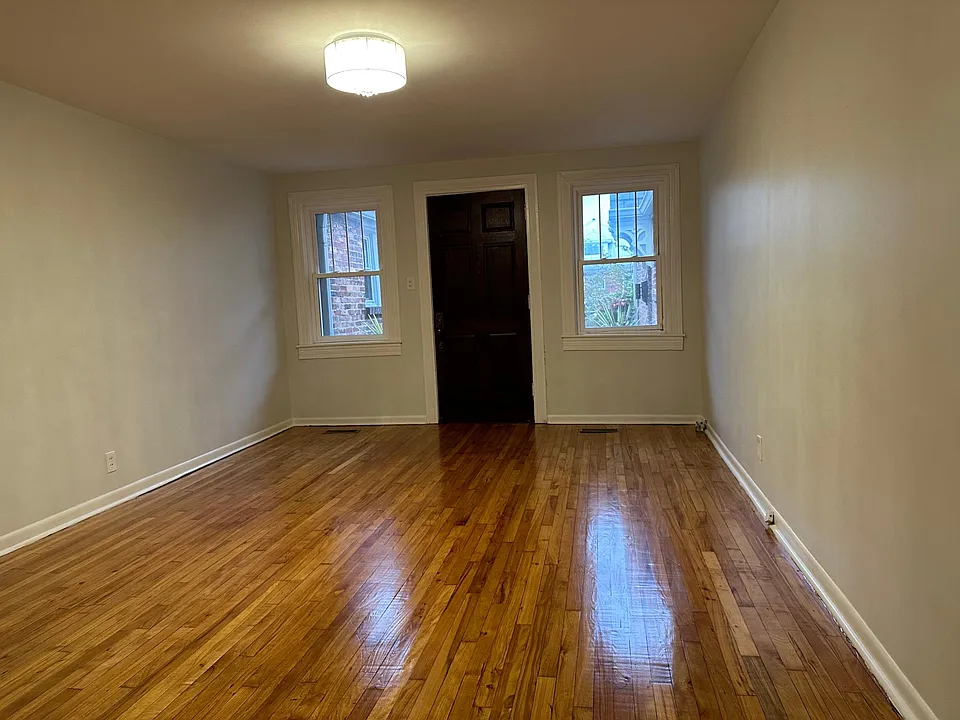 Refinished hardwood floors, new paint and upgraded lighting welcome you home