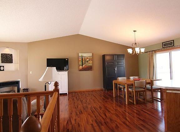 New "Cherrywood" flooring throughout the living and dining rooms, as well as the staircase and kitchen! Vaulted "Great Room" appeal!