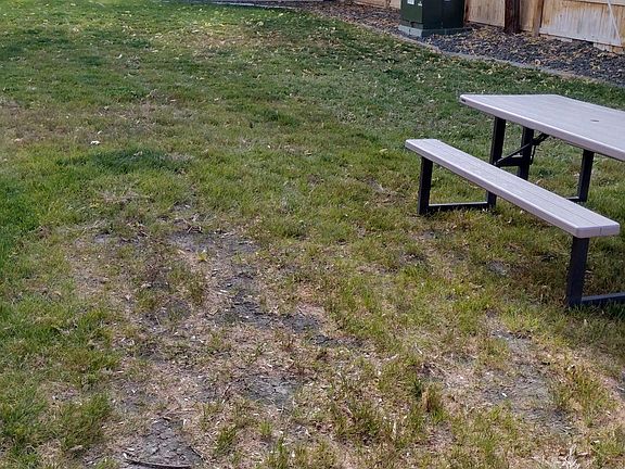 To the left of the unit outside