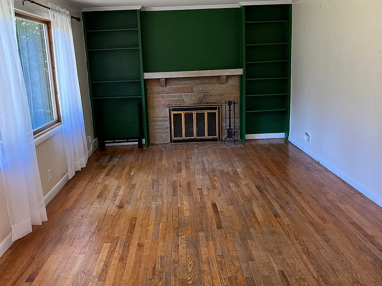 Living room with a window facing the backyard