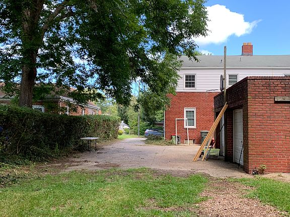 Back view of house. Lots of parking.