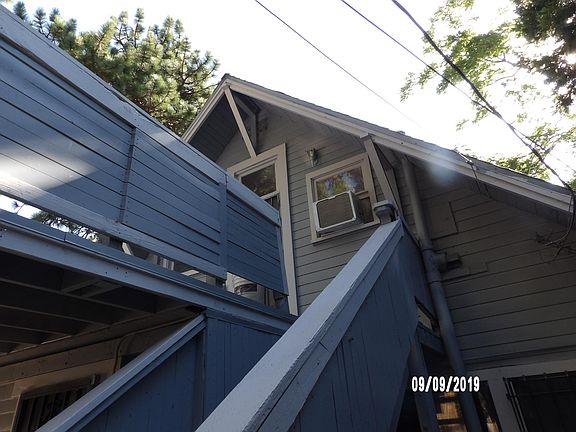 UPSTAIRS ENTRY INTO THE STUDIO. APPROXIMATELY 12 STEPS UP. NICE FRONT DECK.