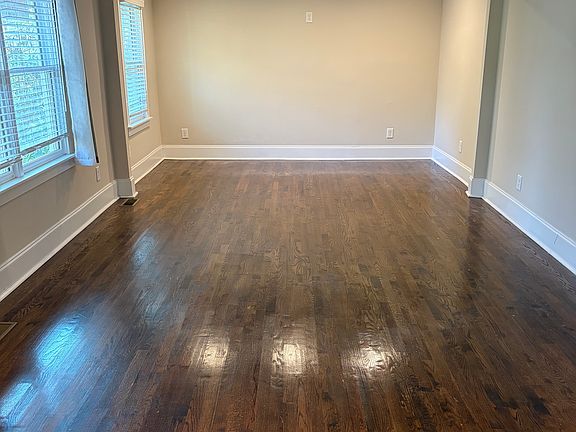 Living room with windows facing front of the house.