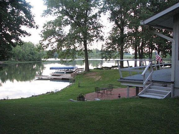 Standing at house looking over lake